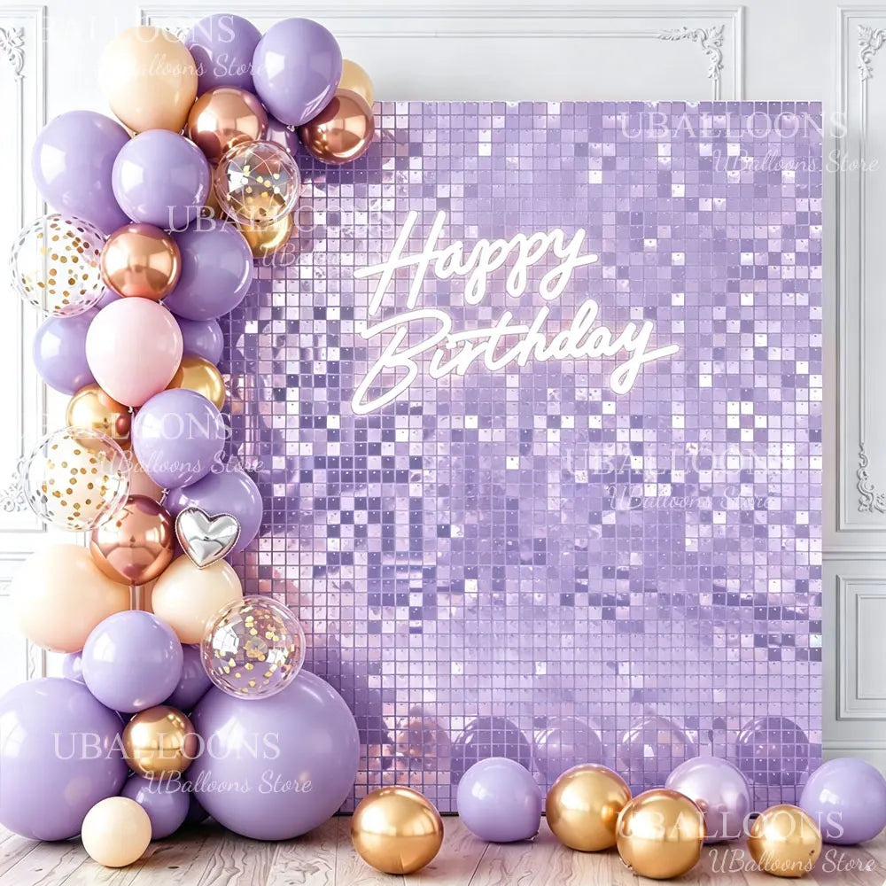 A purple and gold balloon arrangement against a shimmering purple sequin wall backdrop for a birthday party.