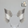 A set of faux fur fox tail and ear costume pieces shown against a gray background.