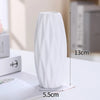 A tall, white ceramic bud vase is shown standing on a white surface with dimension markings.
