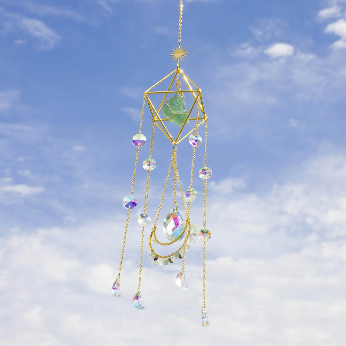 A golden crystal sun catcher with a geometric design and hanging colorful glass beads.