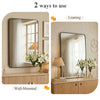 Two ways to use a modern wall mirror with a metal frame: leaning against a wooden cabinet or mounted on the wall.