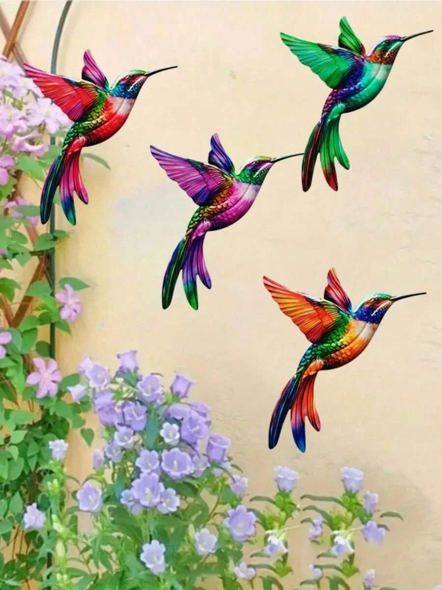 Set of four metal hummingbird wall decor featuring vibrant iridescent colors against a light background.