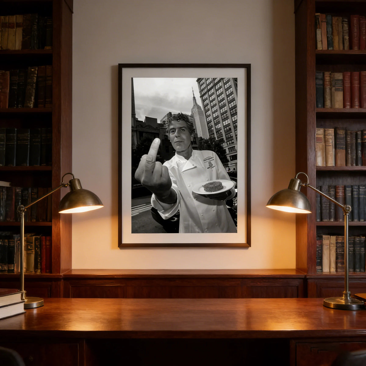 Framed black and white photograph of a man making a peace sign hanging in a wooden bookcase