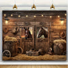 A rustic wooden barn door background featuring a cowboy theme with hay bales, barrels, and antique tools.
