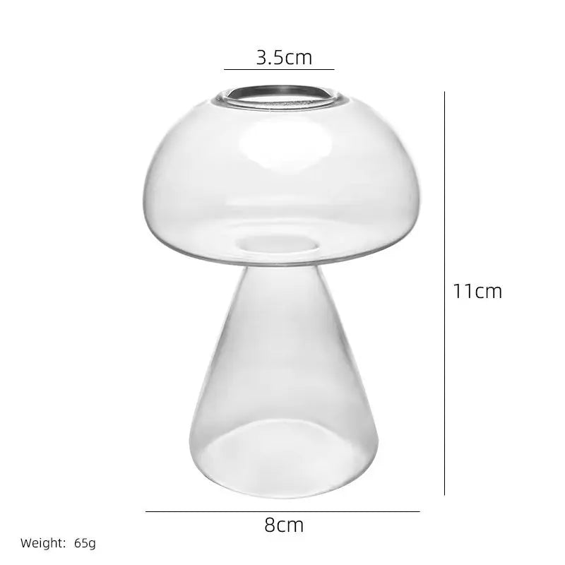 A clear, mushroom-shaped glass vase with a wide opening and a tapered base.