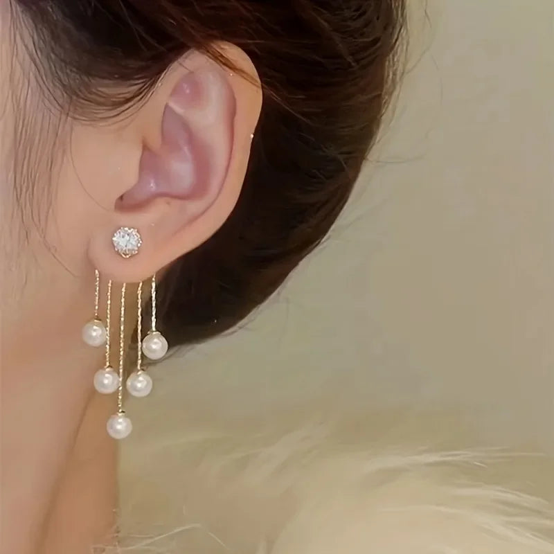 Silver needle pearl tassel earrings with a stud and dangling pearls