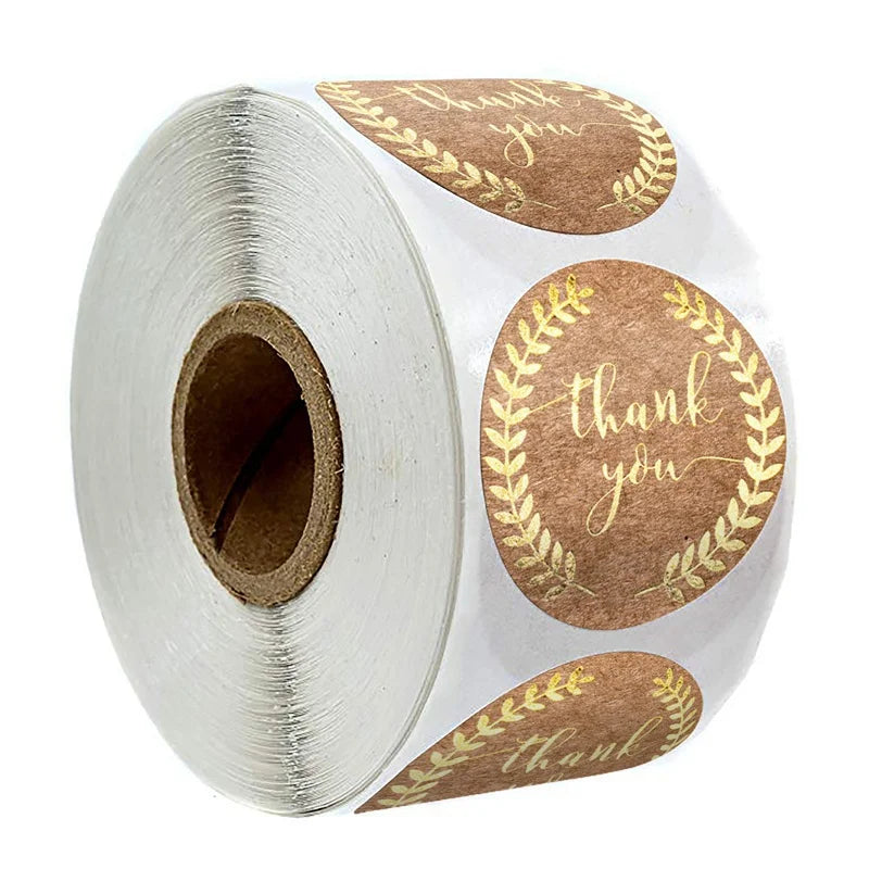 Roll of kraft paper thank you stickers with gold foil lettering for small business packaging