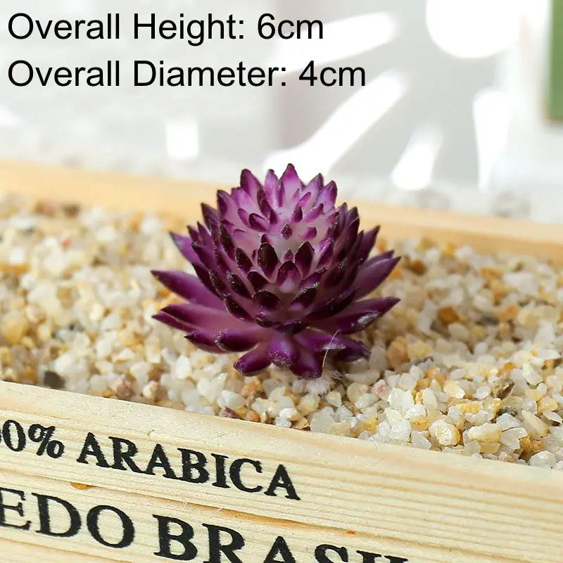 A small, deep purple artificial succulent bonsai ball rests on a wooden tray filled with light-colored gravel.