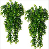 Two lush green artificial vine hanging plants with glossy leaves