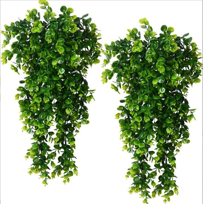 Two lush green artificial vine hanging plants with glossy leaves