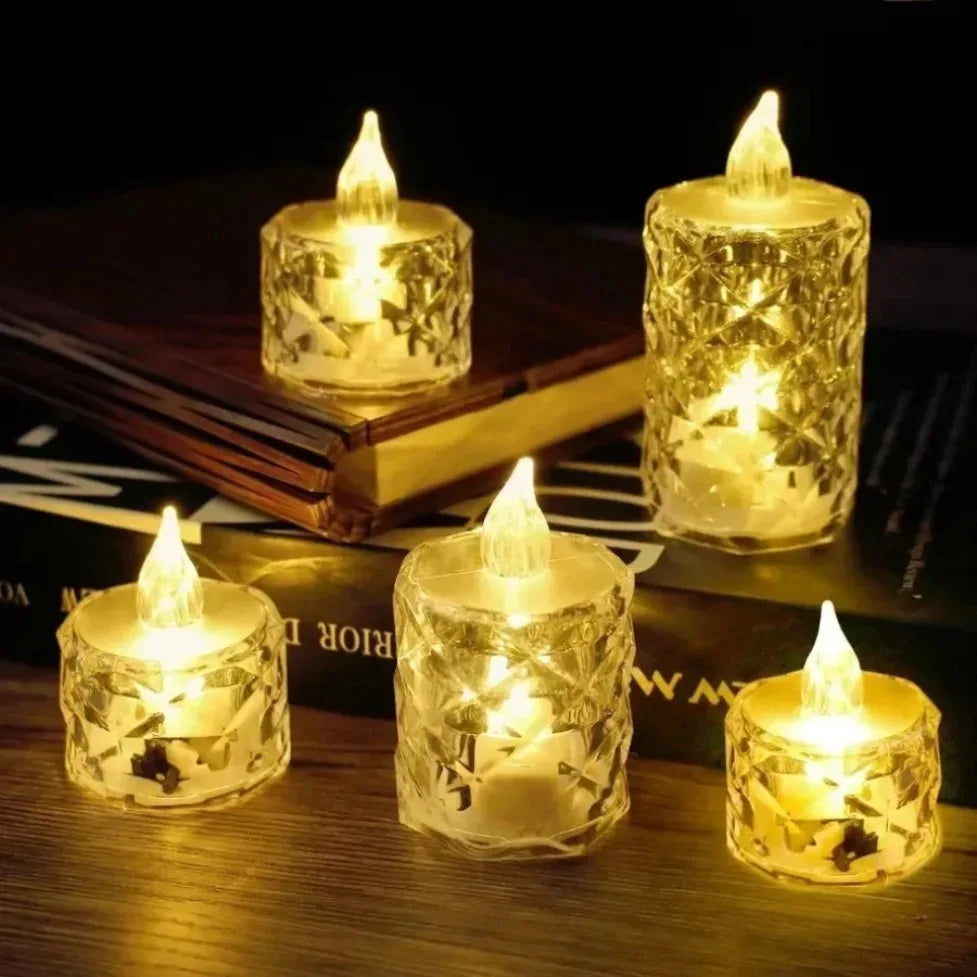 A collection of clear crystal votive candles with realistic flickering LED lights resting on a dark wooden surface.