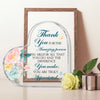 A framed acrylic heart sign with a floral wreath design and elegant script thanking someone for their difference.
