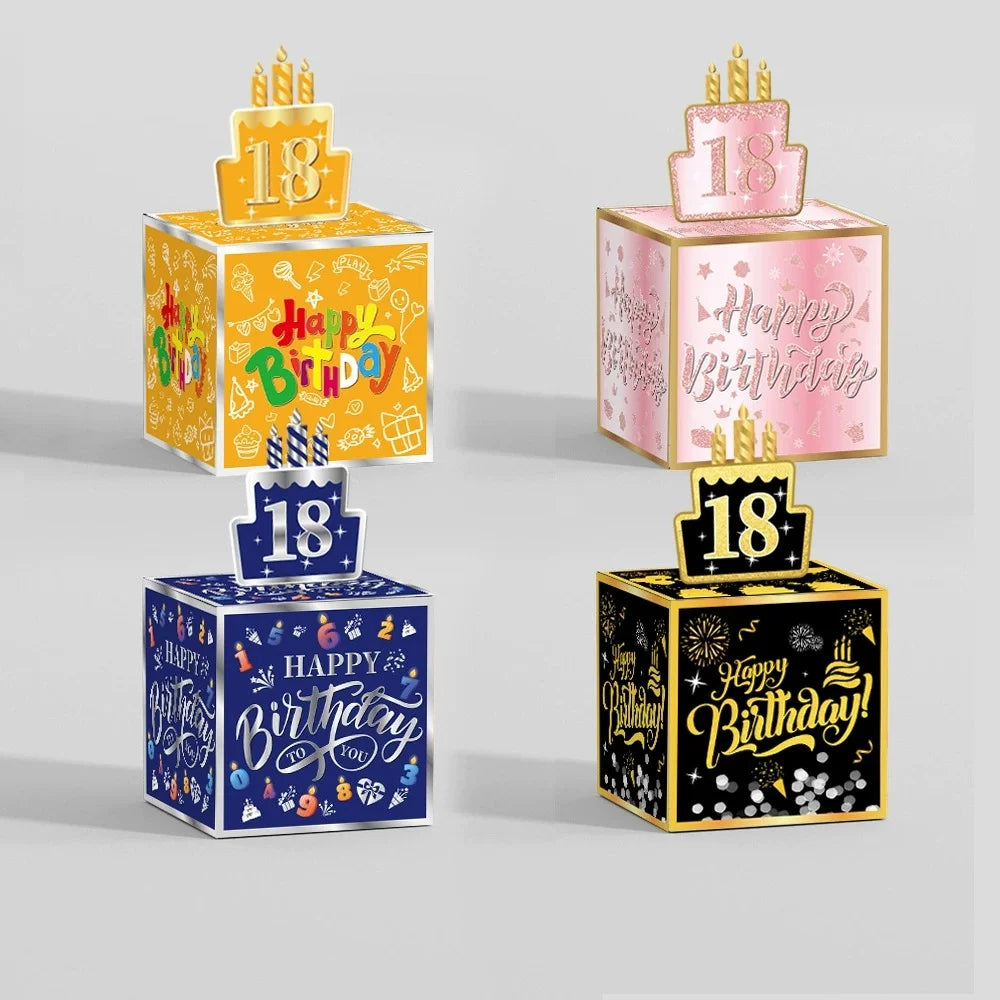 A set of three birthday money gift boxes decorated with various stickers and gold accents.
