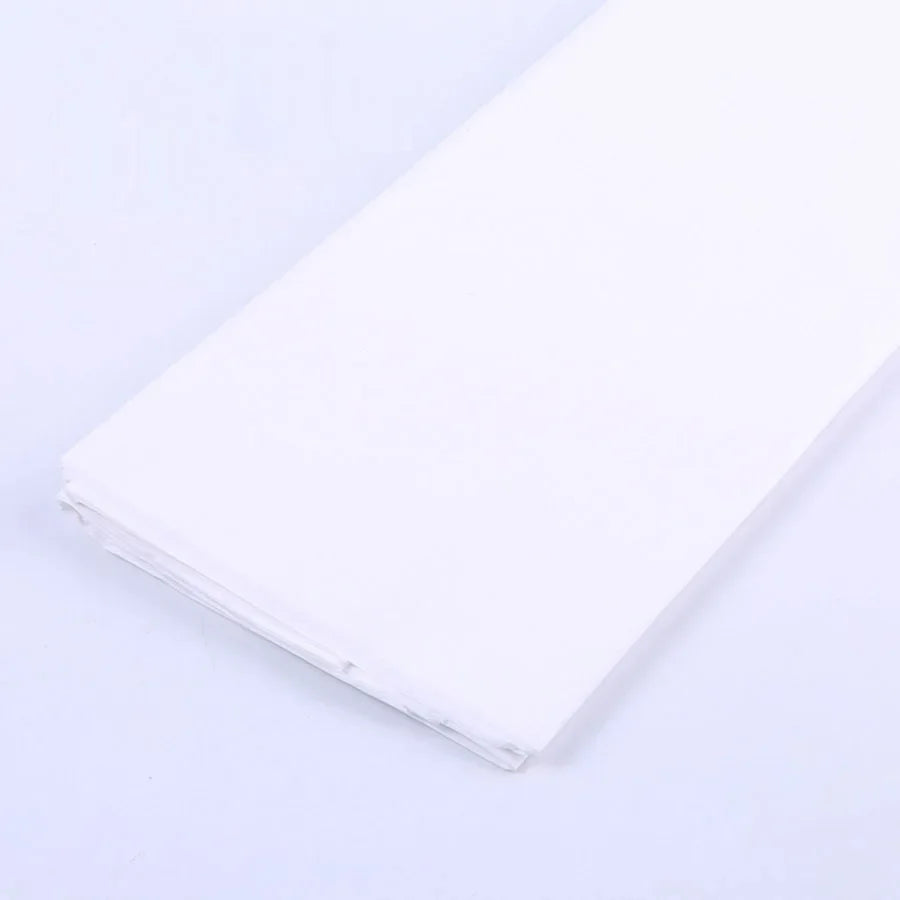 A stack of white soft tissue paper sheets for gift wrapping and DIY crafts.