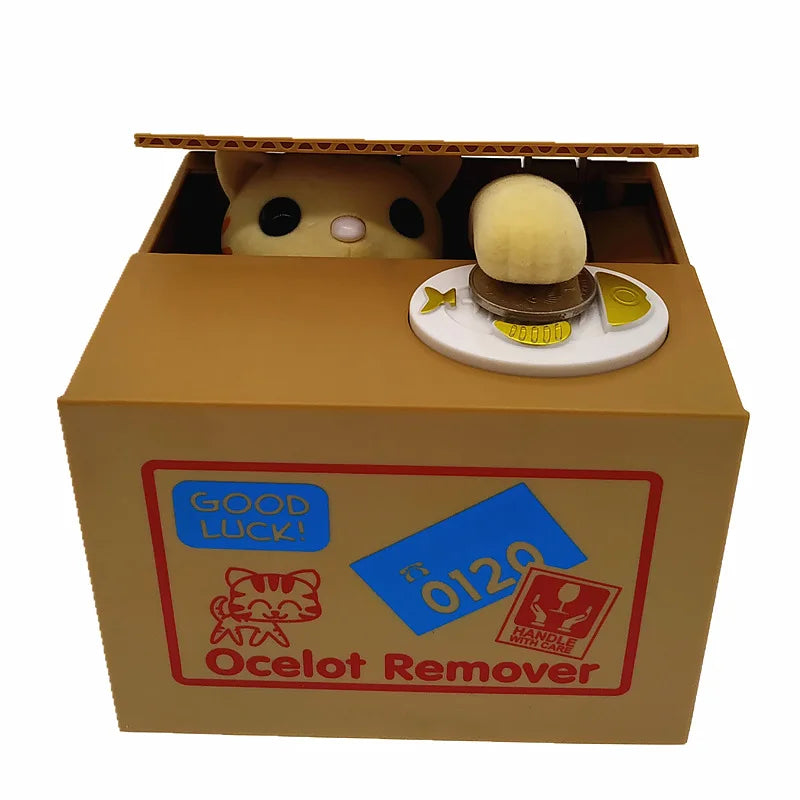 A cardboard box containing an Ocelot Remover product with a ceramic animal design and coin bank.