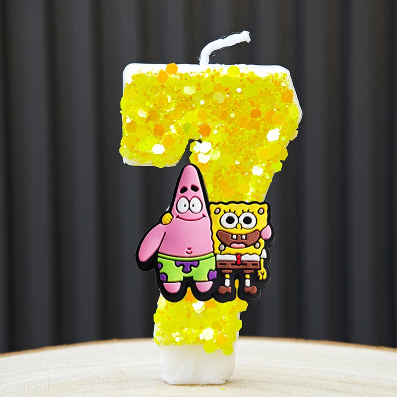 A yellow cake candle shaped like the number 7, decorated with glitter and featuring SpongeBob and Patrick characters.