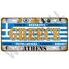 Vintage metal tin sign featuring Greek city names and the word GREECE in distressed blue and gold lettering