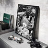 A framed poster of the C-Chainsaw Man anime featuring a character in a white shirt and black tie.