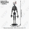 A black and white collectible DIY model of a character with a square head and body, shown standing upright.