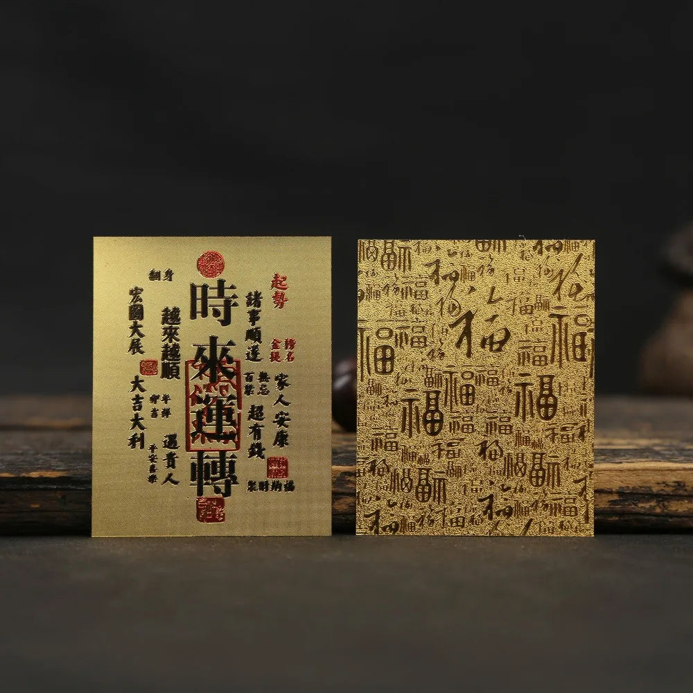 A pair of traditional Japanese-style stickers featuring red and black calligraphy on light brown paper against a dark backgro