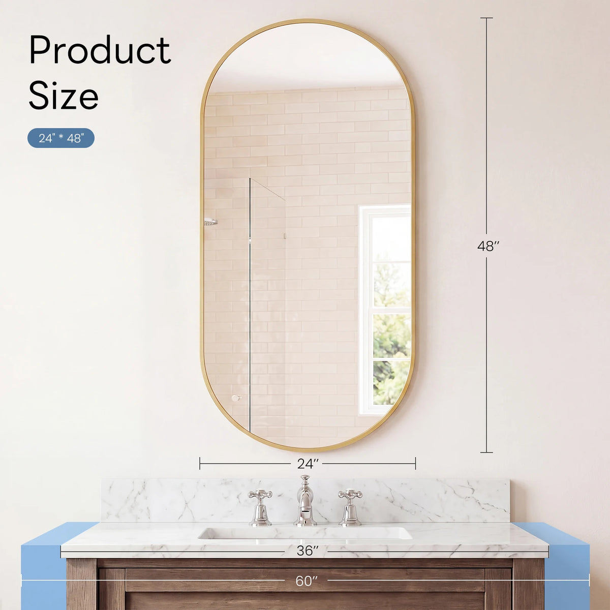Oval wall mirror with a gold metal frame hanging above a marble vanity countertop.