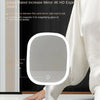 A white LED vanity mirror with a round frame is shown next to a person's hand.