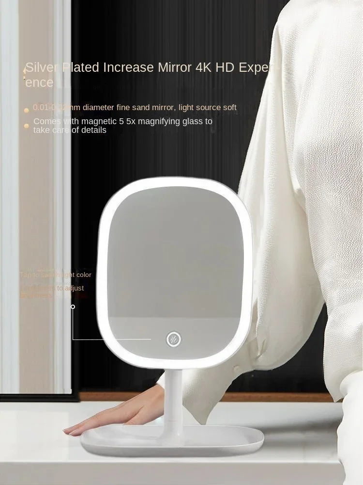 A white LED vanity mirror with a round frame is shown next to a person's hand.