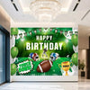 A green football themed birthday backdrop banner featuring a football, trophies, and crowns hanging from a banner.