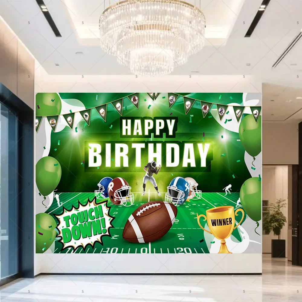 A green football themed birthday backdrop banner featuring a football, trophies, and crowns hanging from a banner.
