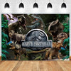 A dramatic backdrop featuring various dinosaurs and a birthday banner for kids.