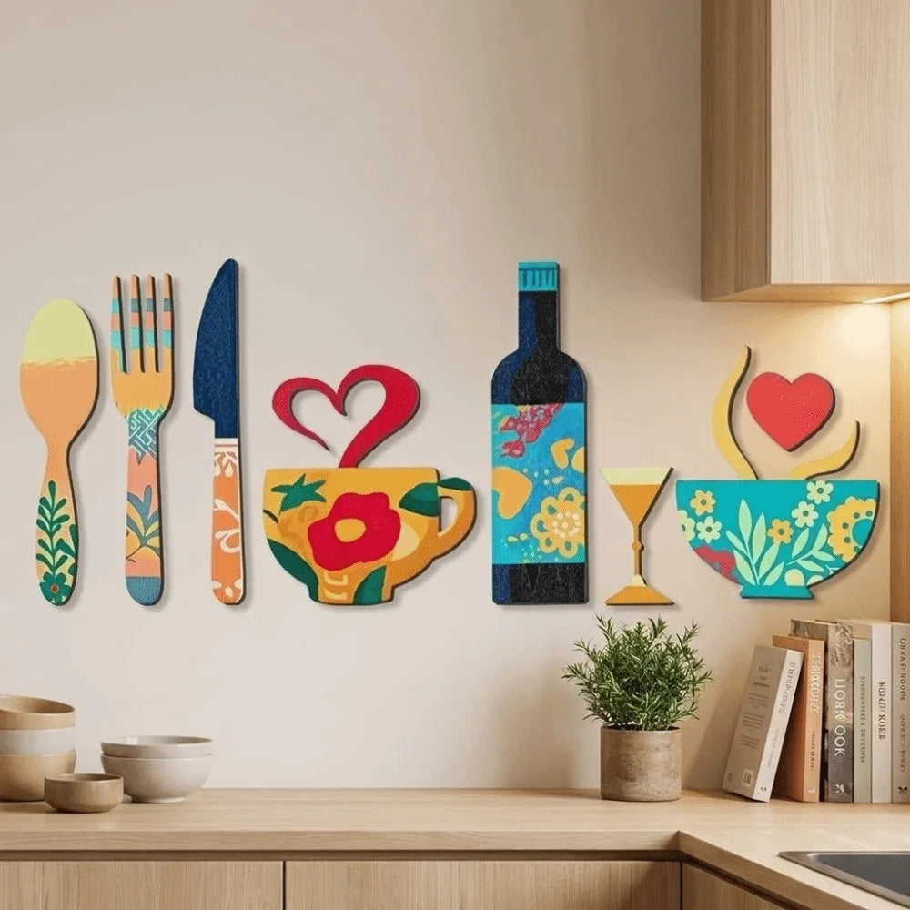 A set of rustic wood floral kitchen decor featuring cutlery and a bottle on a light beige wall.