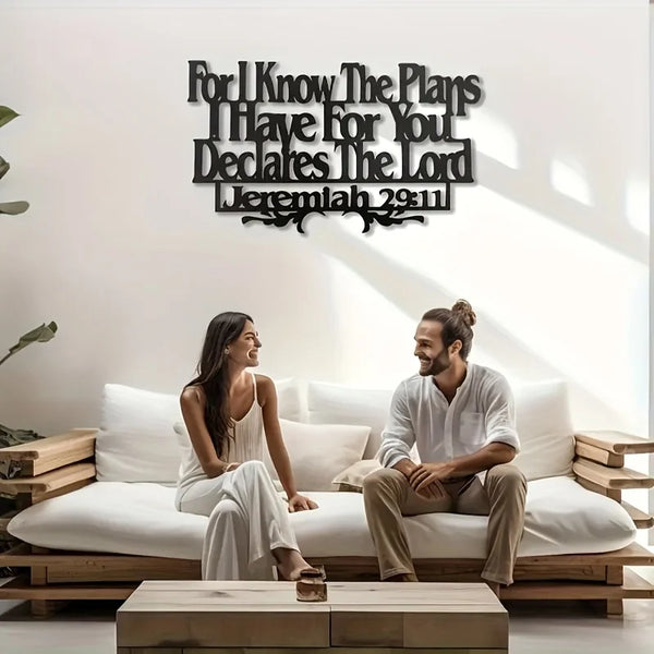 Inspirational metal wall art featuring the Bible verse Jeremiah 29:11 displayed on a white wall.