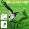 A black eagle wind spinner stake with a long wire, shown against a green lawn.