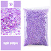 Purple resin rhinestones in a clear bag for crafting projects