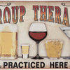 A retro metal sign decoration featuring the text GROUP THERAPY and PRACTICED HERE with illustrations of beer, wine, and a coc