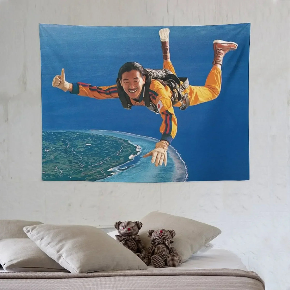 A vibrant tapestry featuring a smiling man in an orange and yellow outfit making a thumbs-up gesture against a blue ocean bac
