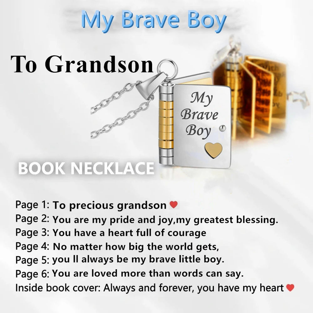 A gold book necklace featuring a message for a grandson, with text inside the book cover.