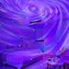 A bedroom illuminated by a purple galaxy projection night light on the ceiling and walls.