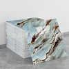 A stack of faux marble 3D self-adhesive wall tiles featuring brown and white veining on a gray background.