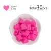 A pile of pink silicone heart beads for DIY jewelry making, totaling 30 pieces.