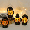 A set of three DIY Halloween pumpkin lanterns with LED projection effects displayed on a white surface.