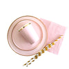 Gold and pink disposable party tableware set including cups, napkins, and straws