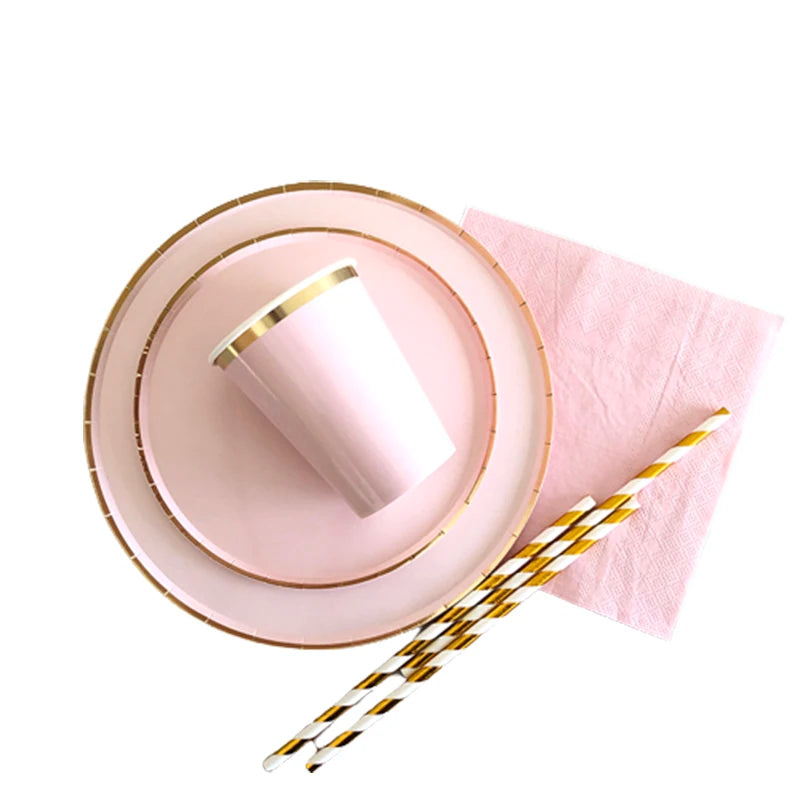 Gold and pink disposable party tableware set including cups, napkins, and straws