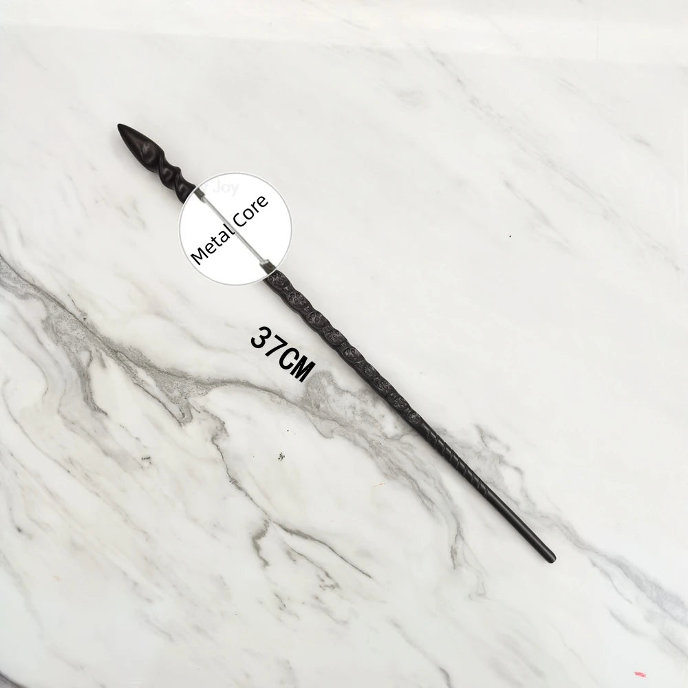 A black metal magic wand replica lying on a white marble surface.