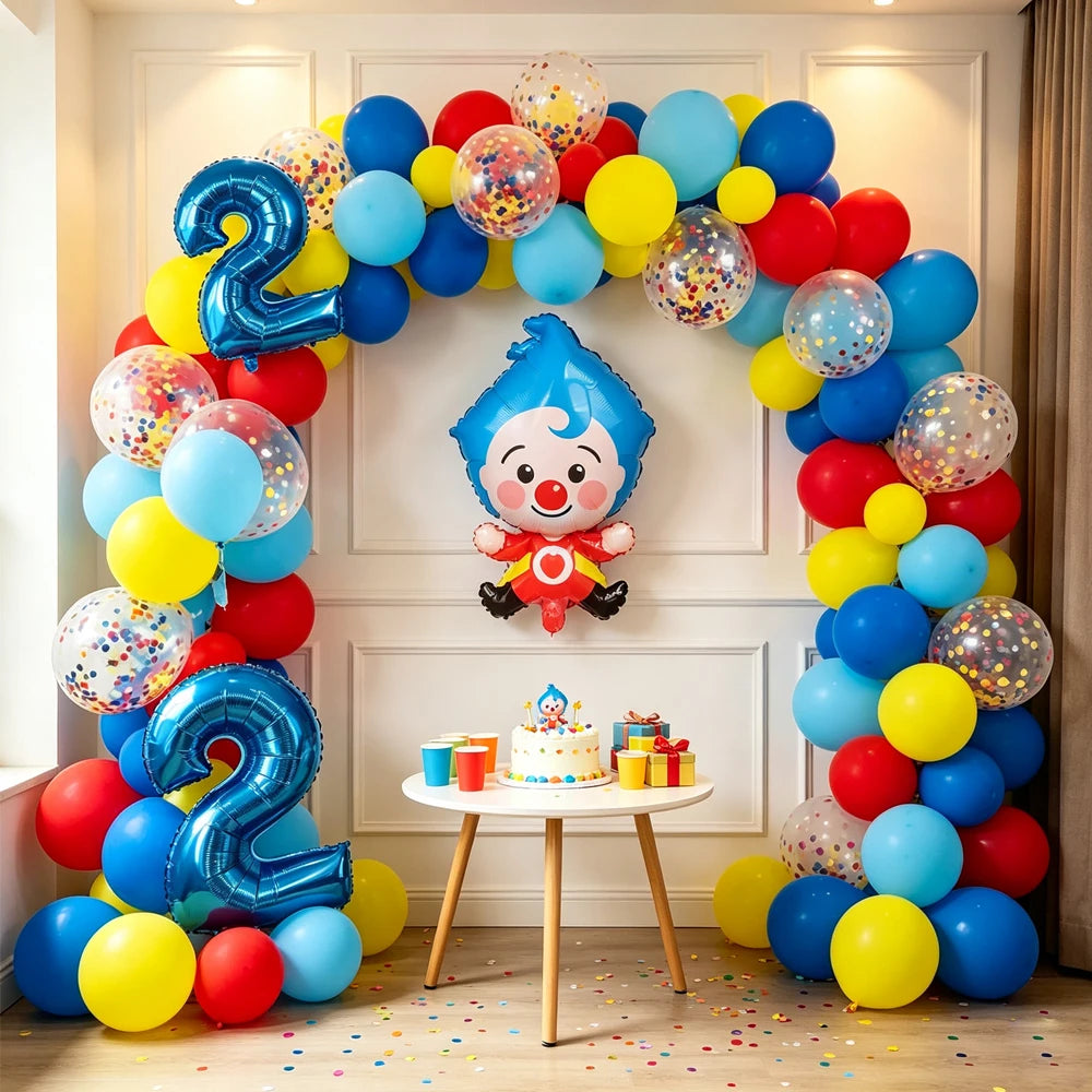A colorful balloon arch garland featuring blue, yellow, and red balloons with a cartoon clown decoration.