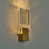 Modern bubble crystal LED wall sconces with vertical textured glass panels casting a warm glow.