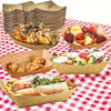 A collection of food items like pastries, fried chicken, and salads served in brown kraft paper disposable trays.