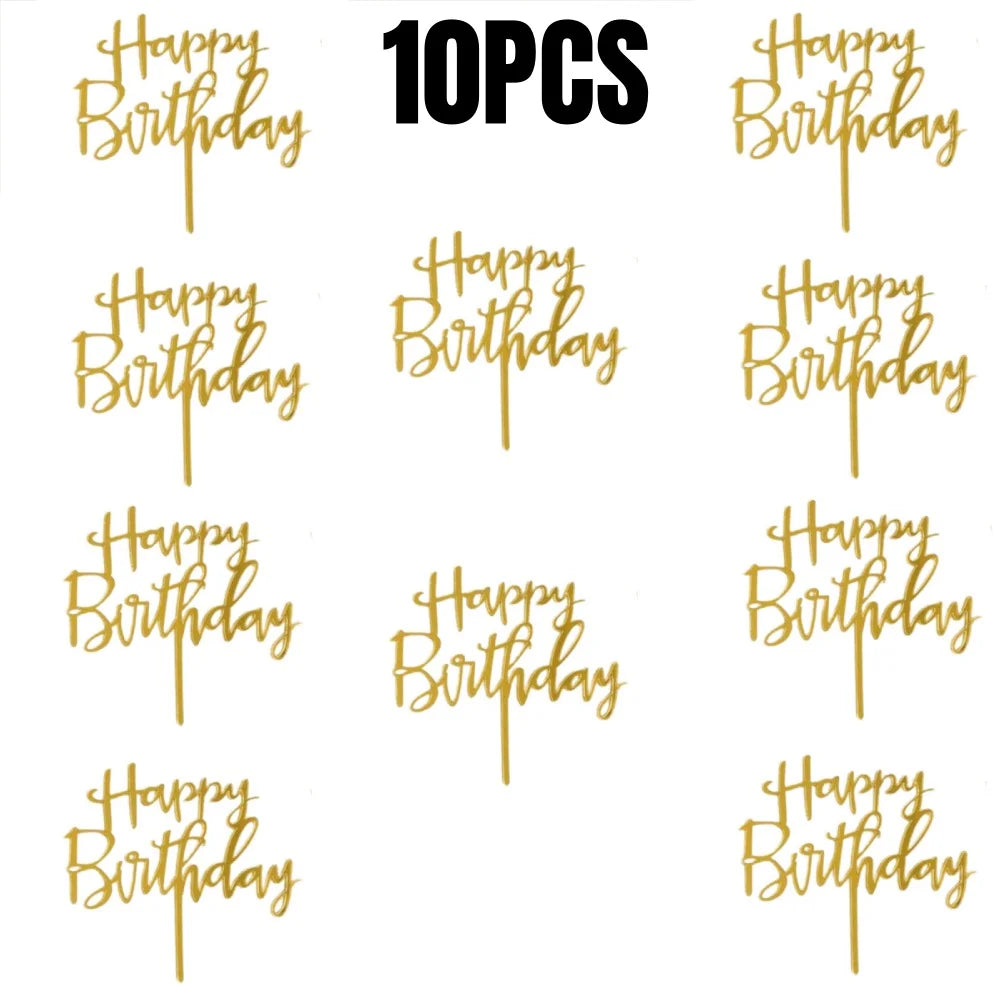A collection of gold acrylic cake topper letters spelling out Happy Birthday in black script.