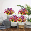 A vibrant arrangement of artificial flowers in various colors like pink, purple, yellow, and green, displayed in white and na