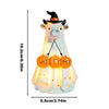A glowing ghost figurine with a witch hat and a welcome sign for Halloween decor